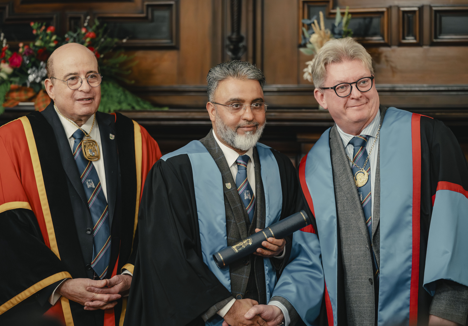 diplomate receiving their diploma